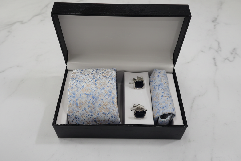 Light blue mosaic tie gift set on white marble background