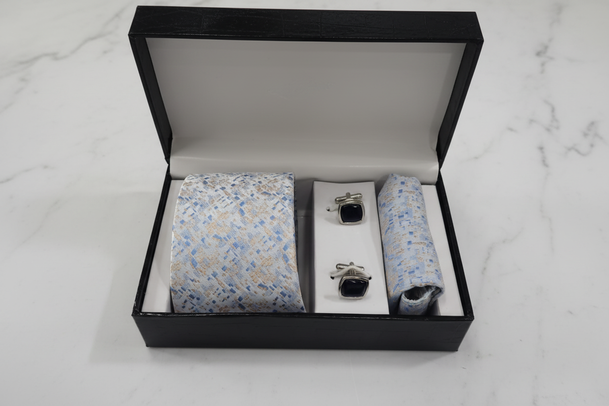 Light blue mosaic tie gift set on white marble background
